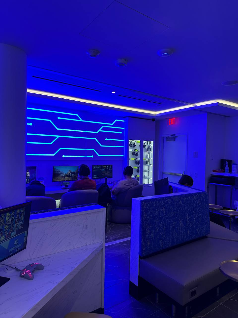 A relaxed pre-departure dinner moment under the “Burn the Ship” sign in the Portal lounge.