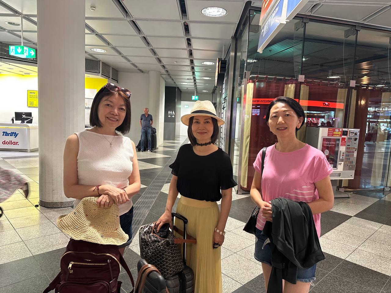 A family photo with our luggage at the rental car area after arrival.
