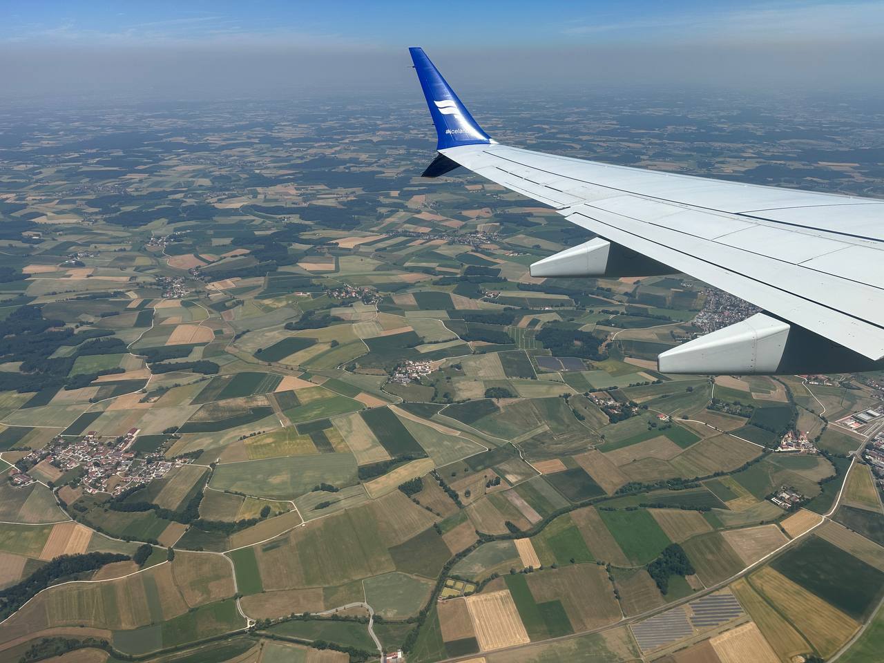 An airplane window view over the fields as we approached Europe.