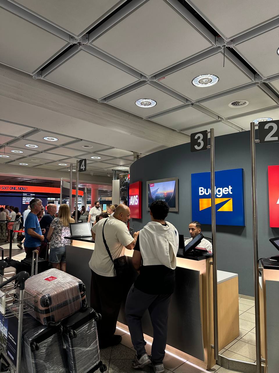 The Avis and Budget rental car counters after arriving in Munich.