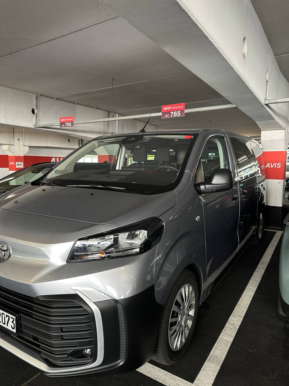 Our silver Toyota van parked in the Avis Preferred garage.